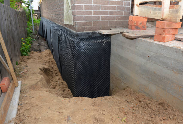 Happy homeowners after waterproofing job in Amherst